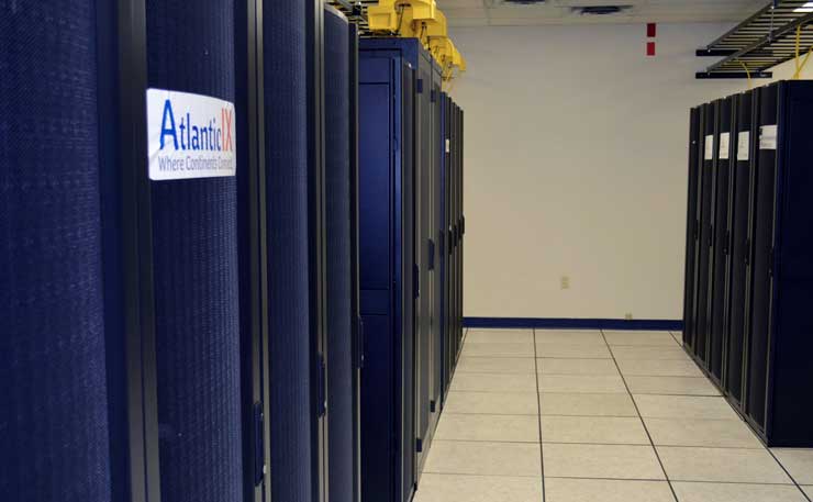 A row of cabinets inside the Fibre Centre data center, located atop a cable route through Moncton, Canada. (Photo: Fibre Centre)